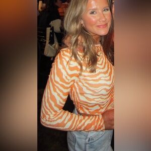 Small, mesh tiger top